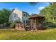 Spacious backyard with gazebo, deck, and lush lawn offering ample space for outdoor activities at 634 E 130Th Way, Thornton, CO 80241