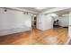 Spacious basement room with hardwood floors and access to another room with exercise equipment at 634 E 130Th Way, Thornton, CO 80241