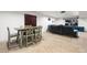 Basement dining area with wooden table, chairs, and a partially visible entertainment area at 634 E 130Th Way, Thornton, CO 80241
