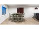Basement with dining area featuring a wooden table with six chairs and a window at 634 E 130Th Way, Thornton, CO 80241