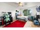 Bedroom featuring carpeted floors, a ceiling fan, a window and red area rug at 634 E 130Th Way, Thornton, CO 80241