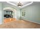 Dining room with carpeting, tray ceiling, an ornate chandelier and ample natural light at 634 E 130Th Way, Thornton, CO 80241