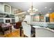 Elegant dining area with views of the living area, kitchen, and a backyard at 634 E 130Th Way, Thornton, CO 80241