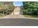 Charming home featuring a three-car garage, brick facade, and mature trees at 634 E 130Th Way, Thornton, CO 80241
