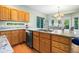 Well-appointed kitchen with stainless steel dishwasher, granite counters, and wood cabinets at 634 E 130Th Way, Thornton, CO 80241
