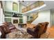 Inviting living room with a fireplace, built-in shelves, and ample seating at 634 E 130Th Way, Thornton, CO 80241