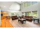Spacious living room with vaulted ceilings, lots of windows, and comfortable seating at 634 E 130Th Way, Thornton, CO 80241