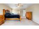 Spacious main bedroom featuring carpeted floors, ceiling fan and ensuite bathroom at 634 E 130Th Way, Thornton, CO 80241