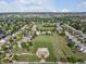 Aerial shot of neighborhood featuring green space with a park and playground at 10371 Knollside Dr, Parker, CO 80134