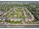 Aerial view of a suburban neighborhood with a park and green space at 10371 Knollside Dr, Parker, CO 80134