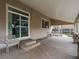 Covered patio with concrete flooring and sliding door entrance to the home at 10371 Knollside Dr, Parker, CO 80134
