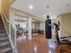 Open basement with workout area and living room space is perfect for entertaining or relaxing at 10371 Knollside Dr, Parker, CO 80134