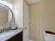 Charming powder room features a granite vanity, modern fixtures, and neutral paint color at 10371 Knollside Dr, Parker, CO 80134