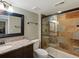 Modern bathroom featuring a glass shower, granite vanity, and neutral color palette at 10371 Knollside Dr, Parker, CO 80134