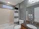 Well-maintained bathroom with shower-tub combo, granite countertop, and decorative mirror at 10371 Knollside Dr, Parker, CO 80134