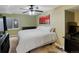 A comfortable bedroom with a cozy bed, dresser, ceiling fan, and bright decor at 10371 Knollside Dr, Parker, CO 80134