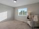 Comfortable bedroom with neutral tones, carpet flooring, and a large bright window at 10371 Knollside Dr, Parker, CO 80134