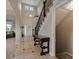 Welcoming foyer with high ceilings, tile flooring, and decorative table at 10371 Knollside Dr, Parker, CO 80134