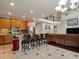 Open-concept kitchen and living area with stainless steel appliances, granite countertops, and barstool seating at 10371 Knollside Dr, Parker, CO 80134