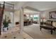 Open-concept living and dining areas featuring neutral paint, carpet, and tile flooring at 10371 Knollside Dr, Parker, CO 80134