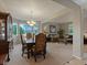 Spacious living room and dining room with neutral paint, carpet flooring, and large windows at 10371 Knollside Dr, Parker, CO 80134