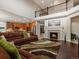 Open concept living area featuring a fireplace, vaulted ceilings, and seamless flow to the gourmet kitchen at 10371 Knollside Dr, Parker, CO 80134