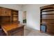 Spacious office features handsome wood built-ins and desk, perfect for a productive work environment at 10371 Knollside Dr, Parker, CO 80134