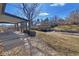 Expansive backyard with covered patio, garden area, and mature landscaping for outdoor enjoyment at 12060 W Carolina Dr, Lakewood, CO 80228