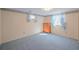 Cozy bedroom featuring a blue carpet, wooden dresser, and bright natural light at 12060 W Carolina Dr, Lakewood, CO 80228