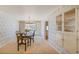 Elegant dining room with a chandelier, wallpaper, and classic decor at 12060 W Carolina Dr, Lakewood, CO 80228