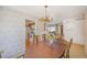 Inviting dining room area leading to the kitchen, perfect for Gathering meals at 12060 W Carolina Dr, Lakewood, CO 80228