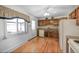 Bright kitchen with wooden cabinets, stainless steel appliances, and hardwood floors at 12060 W Carolina Dr, Lakewood, CO 80228