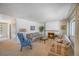 Spacious living room with a fireplace, neutral carpet, and ample natural light at 12060 W Carolina Dr, Lakewood, CO 80228