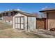 Outdoor storage shed in backyard offering ample space for tools, equipment, and other belongings at 12060 W Carolina Dr, Lakewood, CO 80228