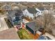 Aerial view of a well-maintained home with a patio, backyard, and detached garage in a quiet neighborhood at 2949 Emporia Ct, Denver, CO 80238