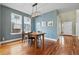 Open dining room with hardwood floors, neutral walls and natural lighting at 2949 Emporia Ct, Denver, CO 80238