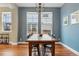 Bright dining room with hardwood floors, large windows and modern lighting at 2949 Emporia Ct, Denver, CO 80238