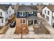 Charming two-story home with a brick facade, inviting porch, and well-manicured landscaping at 2949 Emporia Ct, Denver, CO 80238