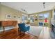 Cozy living room with hardwood floors, fireplace, and a view of the patio at 2949 Emporia Ct, Denver, CO 80238