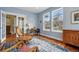 Comfortable living area with hardwood floors, rocking chairs, bright windows, and stylish decor at 2949 Emporia Ct, Denver, CO 80238