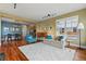 Open-concept living area with hardwood floors and stylish furnishings at 2949 Emporia Ct, Denver, CO 80238