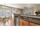 Kitchen with a breakfast bar that offers casual seating with a stainless steel dishwasher at 5537 Lewis Ct # 101, Arvada, CO 80002