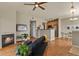 Inviting living room with fireplace, hardwood floors, and an open concept layout at 5537 Lewis Ct # 101, Arvada, CO 80002