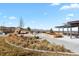 Community park with landscaped walking areas, a rock climbing structure, and mountain views at 5537 Lewis Ct # 101, Arvada, CO 80002