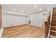 Finished basement with hardwood floors and easy access to stairs at 2351 N Emerson St, Denver, CO 80205