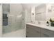 Modern bathroom features a glass shower with eye-catching tile and updated vanity at 2351 N Emerson St, Denver, CO 80205
