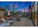 A spacious outdoor deck features lounge seating and an umbrella-covered dining set at 2351 N Emerson St, Denver, CO 80205