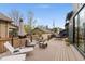A spacious outdoor deck features lounge seating and an umbrella-covered dining set at 2351 N Emerson St, Denver, CO 80205