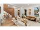 Bright and modern living space with a exposed brick wall, stylish furniture, and large windows offering great natural light at 2351 N Emerson St, Denver, CO 80205