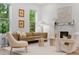 Bright living room featuring a modern fireplace, neutral furniture, large windows with natural light, and hardwood floors at 2351 N Emerson St, Denver, CO 80205